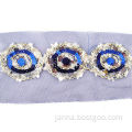 Woven trims, made of metallic golden cord, blue/silver sequin and blue color mesh